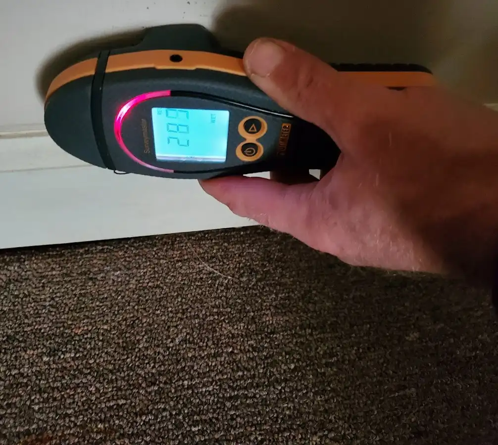 Moisture detection at baseboard during Storm Damage Restoration in Casper